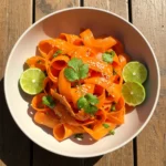 Carrot ribbon salad recipe served fresh with sesame and lime