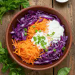 Healthy red cabbage coleslaw recipe in rustic bowl