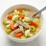 Anti-Inflammatory Cauliflower Chicken Soup with carrots, celery, and shredded chicken