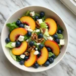 Blueberry Peach Feta Salad with peaches, blueberries, feta, and walnuts