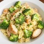 Cheesy Chicken Broccoli Orzo with chicken and broccoli in a creamy sauceA hearty bowl of Cheesy Chicken Broccoli Orzo made with tender chicken, fresh broccoli, and creamy orzo pasta.
