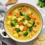 Cozy Creamy Vegetable Soup in rustic bowl with garnish