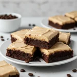 Frosted Coffee Brownies with creamy coffee frosting on a plate