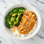 Healthy Sticky Chicken Bowls Recipe with rice, broccoli, and spicy mayo