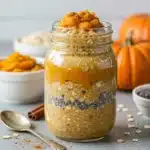 Pumpkin Overnight Oats in a mason jar with pumpkin puree and chia seeds