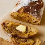 Fresh loaf of Cinnamon Swirl Pumpkin Sourdough Bread with swirl visible