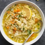 Cozy chicken and stars soup served in a rustic bowl with parmesan and parsley.