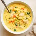 Creamy Chicken Pasta Soup served in a rustic bowl