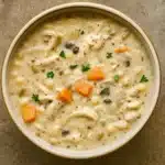 creamy crockpot chicken wild rice soup served hot with parsley garnish