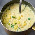 Creamy vegan gnocchi soup in a rustic bowl