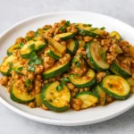 Ground turkey and zucchini skillet served in a cast iron pan with Parmesan