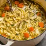 homemade chicken noodle soup in rustic bowl