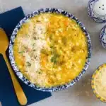 Italian Chicken Pastina Soup served in a rustic bowl with parmesan and herbs