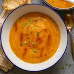 one pot creamy carrot lentil soup in a rustic bowl