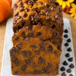 Pumpkin Chocolate Chip Bread on wooden board with slices