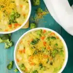 Bowl of Broccoli Cheese and Potato Soup with melted cheddar