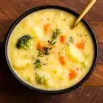 broccoli potato cheese soup in a rustic bowl