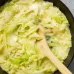Creamed cabbage recipe served in rustic bowl