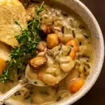 Creamy Mushroom & Wild Rice Soup in rustic bowl