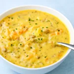 creamy crock pot cheeseburger soup served in rustic bowl