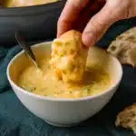 Easy Broccoli Cheddar Soup in rustic bowl with bread