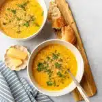 Italian Pastina Soup in rustic bowl with Parmesan and parsley