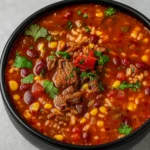 Mexican Beef and Rice Soup with avocado, cheese, and tortilla strips
