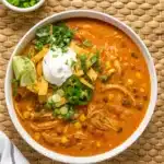 One Pot Creamy Chicken Enchilada Soup served with toppings