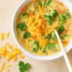 Panera Broccoli Cheddar Soup in a cozy bowl with bread.