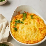 Paula Deen Corn Casserole Recipe baked golden in rustic dish