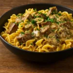 Crockpot Beef Stroganoff served over egg noodles