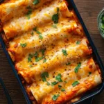 Easy Bean and Cheese Enchiladas served with sauce and cilantro