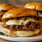French Onion Beef Sloppy Joes sandwich with melted cheese and onions