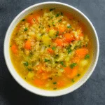 Garlic Soup For Colds in a warm rustic bowl