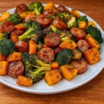 Honey Garlic Sheet Pan Sausage dinner on rustic pan