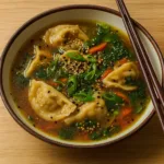 Savory Asian Potsticker Soup in a bowl with dumplings and vegetables