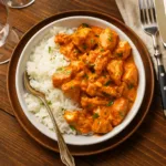 coconut chicken rice bowl served with rice and cilantro