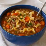 Easy Hamburger Noodle Soup in bowl with parsley garnish