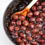 Spicy Cranberry BBQ Meatballs appetizer in glossy cranberry BBQ sauce