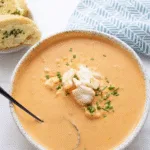Creamy Crab Bisque in a rustic bowl with chives