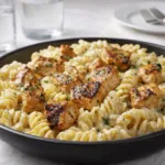Crispy Honey Garlic Chicken over Creamy Rotini Pasta