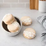 Irish Cream Macarons served on a rustic plate