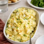 Southern Potato Salad served in a bowl with paprika and eggs