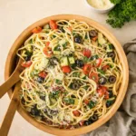 Best Italian Spaghetti Salad in a rustic wooden bowl