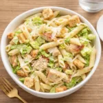 Chicken Caesar Pasta Salad in a serving bowl