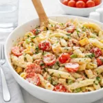 Chicken Club Pasta Salad served in a white bowl