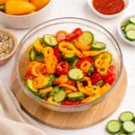 Fresh Cucumber and Sweet Pepper Salad in a white bowl