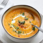 easy carrot soup in bowl on wooden table