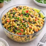 Mexican Macaroni Salad in a large bowl with beans, corn, and creamy taco dressing