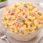 A large bowl of creamy Sweet Macaroni Salad with carrots and peppers